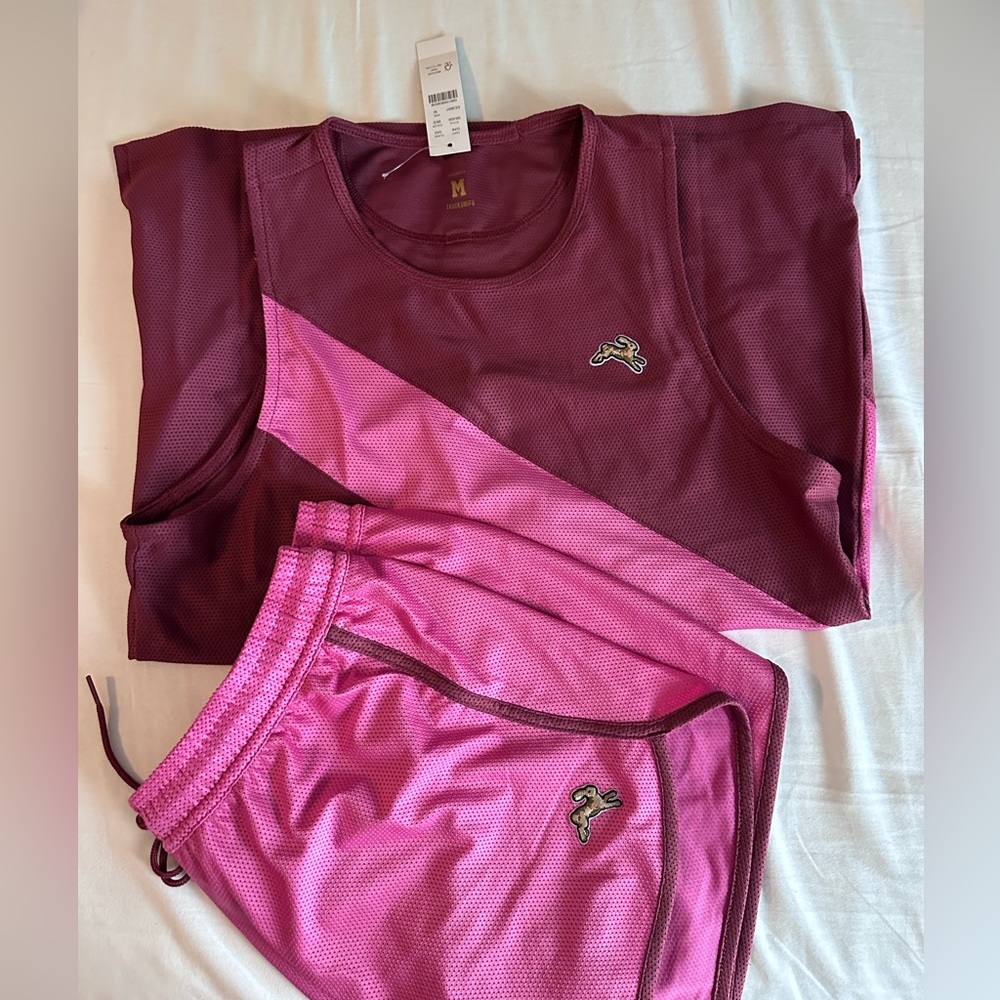 Tracksmith running set. Singlet top and shorts in pink